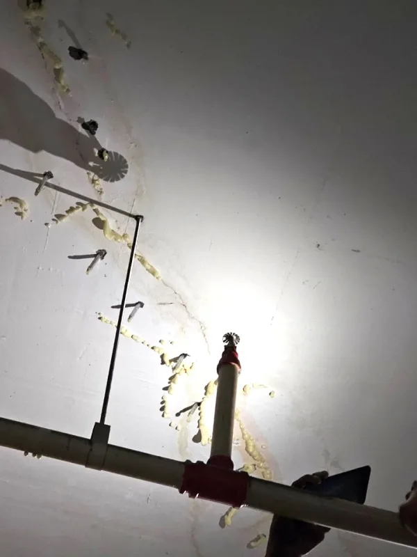 PU injection waterproofing process filling voids in concrete slab to stop water infiltration.