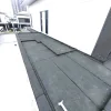Professional torch-on bitumen waterproofing applied to a rooftop balcony.