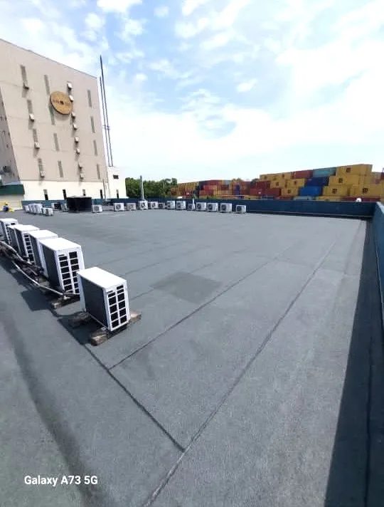 “Torch-on membrane waterproofing installation on a flat roof in Selangor