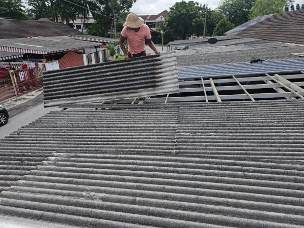 metal deck replacement Technician fixing roof leaking issue in KL residential property